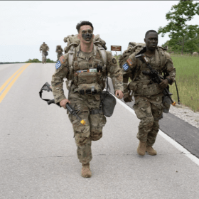 Capt. Evan Shortsleeve (left) and Sgt. Billy Akebe, from the 59th Chemical Company (Hazardous Response) at Fort Drum, New York, ruck march May 31 near Training Area 148, during the 2024 International Best CBRN Warrior Competition. Shortsleeve and Akebe were named the competition’s winners June 3 during an awards ceremony in Lincoln Hall Auditorium. (Photo by Melissa Buckley, Fort Leonard Wood Public Affairs Office)